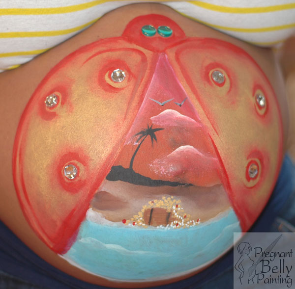 pregnant belly painting with lady bug