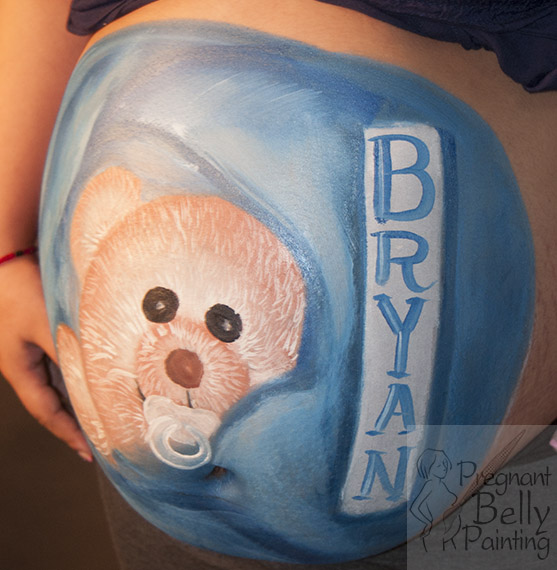 pregnancy belly painting of a teddy bear